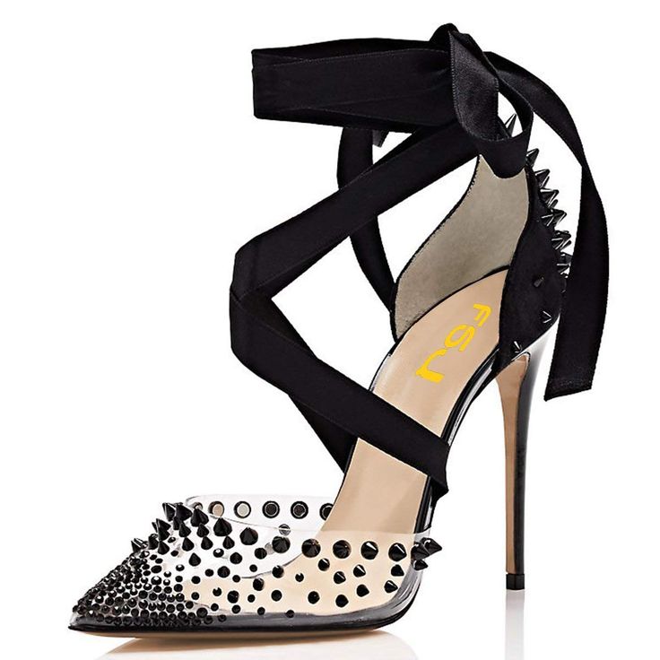 the image shows a pair of women's highheeled shoes.  the shoes have a clear pvc upper adorned with black studded embellishments. a black ribbon wraps around the ankle and fastens at the back. the heels are stiletto style and the toe is pointed. the shoes appear to be designed for a formal or special occasion.  the brand label "allegra k" is visible on the insole.