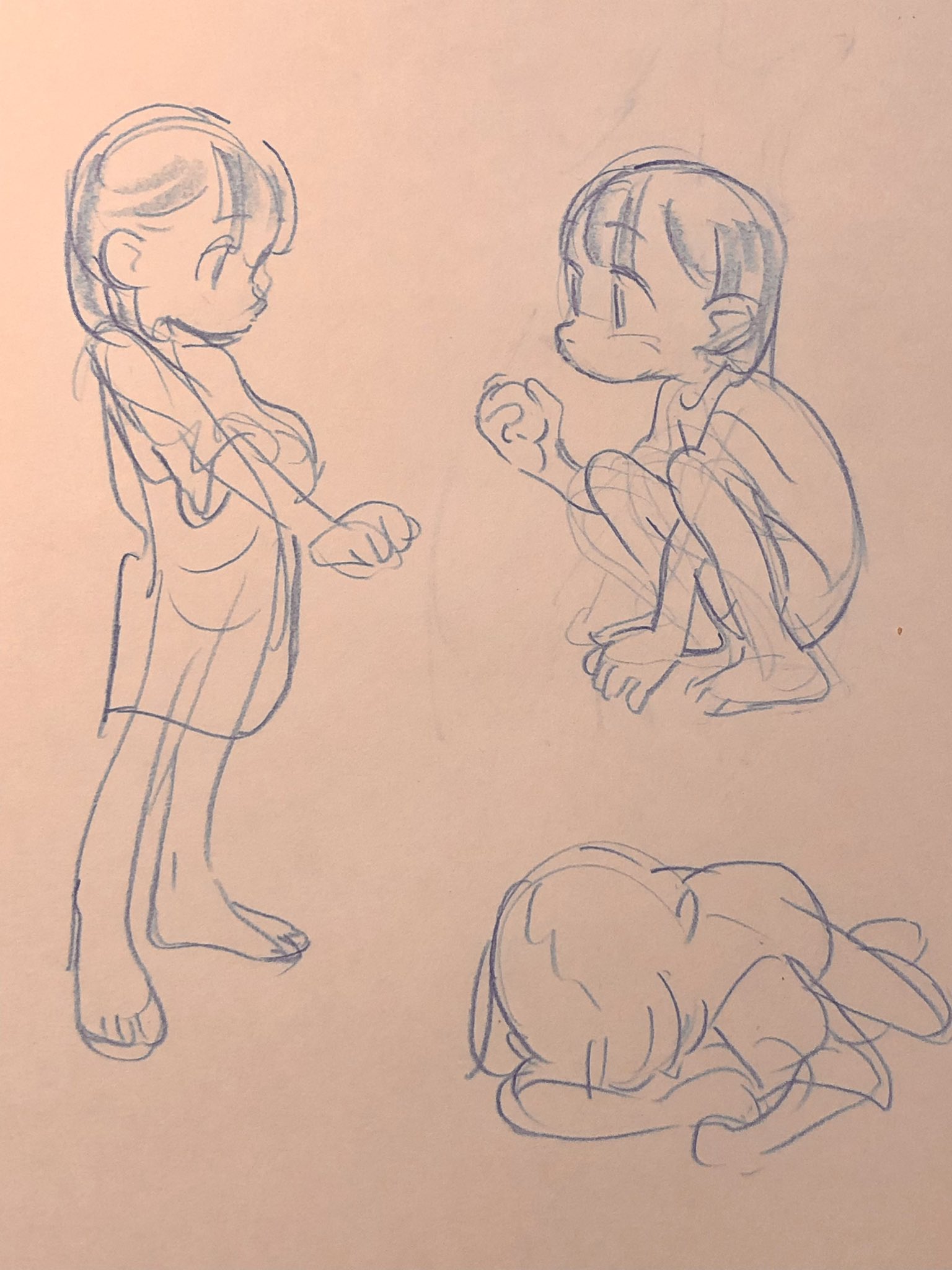 this image shows three different blue line drawings of the same child character on tan paper. the first drawing in the top left shows the full body of the child standing and looking to the right. the second drawing in the top right shows the child crouching, also looking right. the third drawing in the bottom center shows the child curled up on their side.