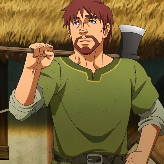 a cartoon man with short brown hair and a beard stands while holding a wood axe over his right shoulder. he is wearing a dark green, longsleeved shirt and brown pants with a black belt. the background is blurry but shows a thatched roof and a blue sky.