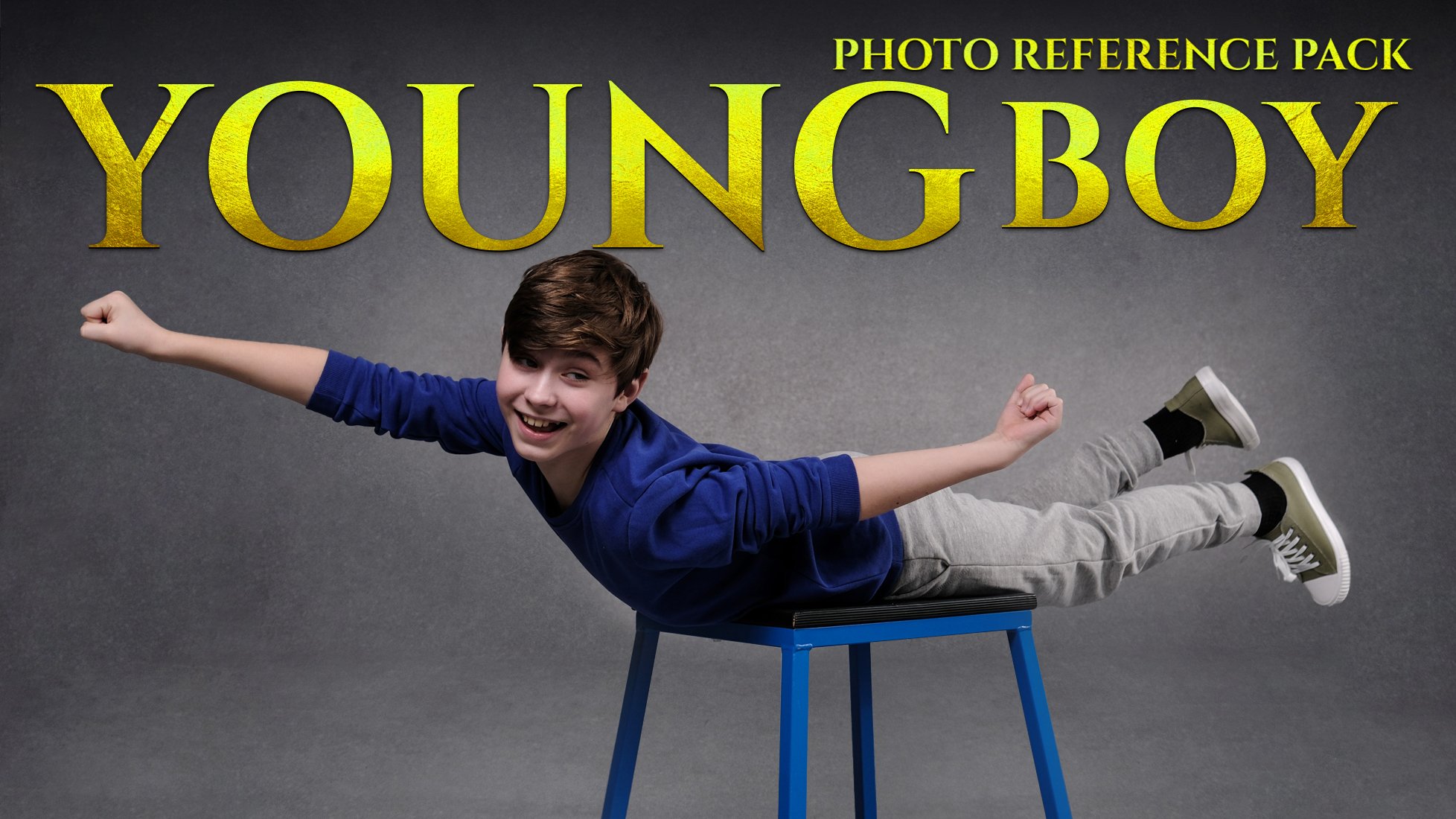 the image showcases a young boy, approximately 1013 years old, playfully lying on his stomach on a blue stool with his arms outstretched as if in flight. he's wearing a blue longsleeved shirt, grey sweatpants, and olivegreen sneakers. his expression is bright and joyful, indicative of a happy and energetic mood.  the background is a plain, muted grey, keeping the focus entirely on the boy and his dynamic pose.  text overlayed on the image reads "photo reference pack youngboy" in a gold, stylized font, suggesting the image is intended as stock photography for use in art or design projects. the overall mood is lighthearted and playful.