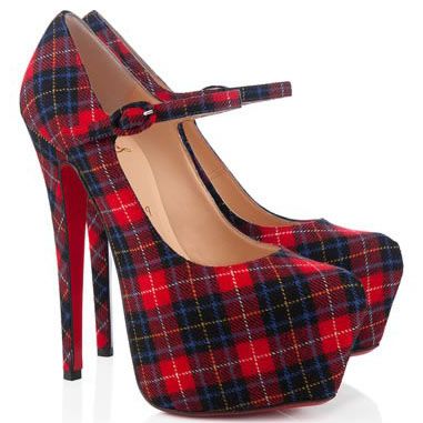 a pair of red, black, and blue plaid platform mary jane high heels with red soles are angled on a white surface.