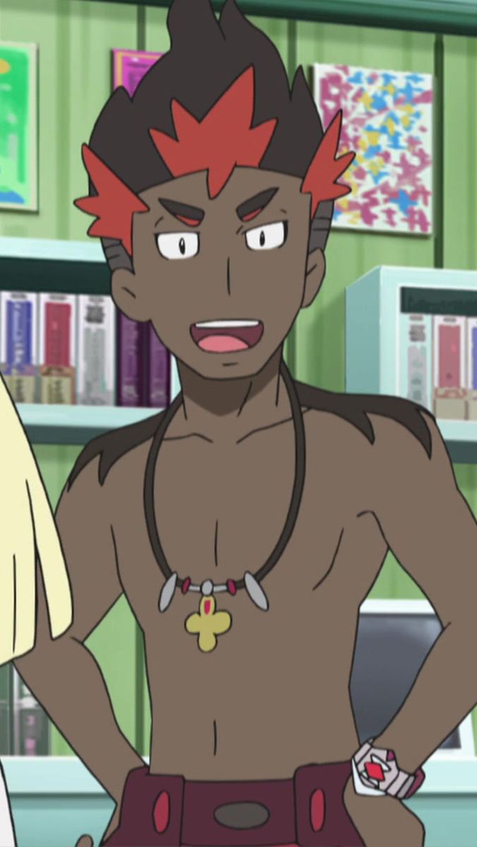 a smiling male character from the anime pokemon is shown in the image. the character has black hair with red highlights, brown skin, and a necklace with a gold cross pendant. he is shirtless and wearing a red and black belt around his waist. he is also wearing a red and black watch. the background is a blue and green bookshelf with books on it. there is also a white object on the right side of the image.