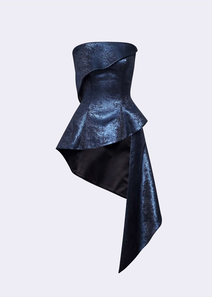 a strapless blue dress with a peplum and asymmetrical hem is featured in the image. the dress appears to be made from a textured fabric with a slight sheen.