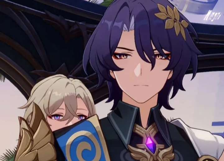 the image is a closeup shot appearing to be a screenshot or fanart of two characters from the video game genshin impact. the focus is on a character with purple hair and gold hair ornament, who has a serious expression.  partially visible behind them is another character with blonde hair, whose face is mostly obscured.  both characters are styled in a way consistent with the animeinfluenced art style of the game, sporting elaborate clothing and accessories with gold and purple hues. the background is dark and blurred, drawing attention to the characters in the foreground.