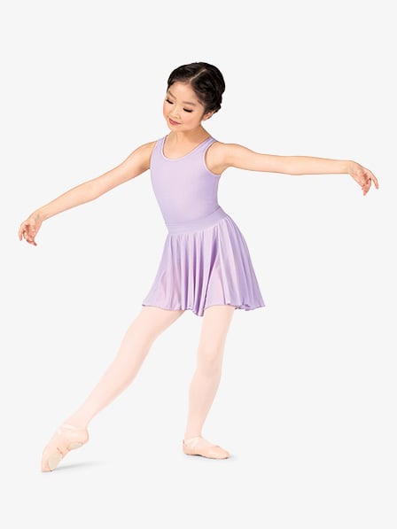 a young girl, possibly a child ballet dancer, is shown in a fullbody shot against a white background. she is wearing a lavendercolored leotard and a matching short ballet skirt. her pointe shoes are a light beige color.  she has dark hair styled up, and her pose suggests grace and movement.  the overall image is clean and bright.