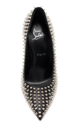 a pair of black leather high heel pumps with silver spikes. they are pointytoed and have a stiletto heel. the shoes are from the designer christian louboutin.