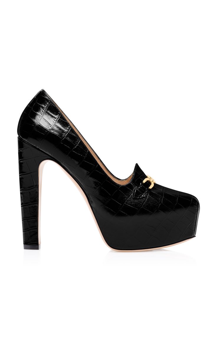 a closeup studio shot of a single black highheeled women's shoe with a crocodileembossed leather upper and goldtoned hardware on the vamp.  the shoe has a thick platform and a chunky heel. the shoe is presented against a plain white background.