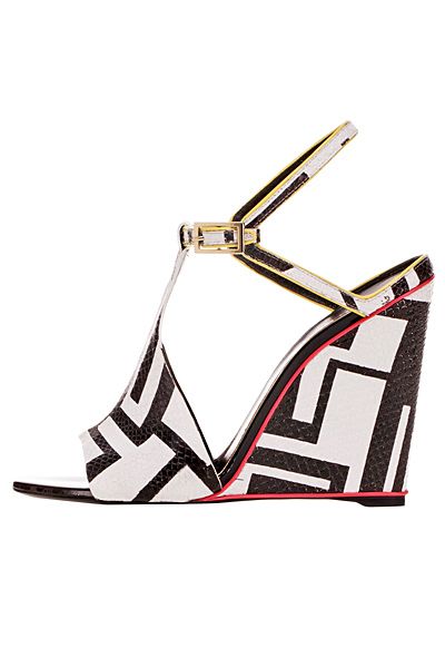 a closeup shot of a pair of women's black and white geometric print wedge sandals with a tstrap and ankle strap. the shoes are opentoed and have a high wedge heel. the design is modern and stylish, suitable for summer wear.  the background is plain white.
