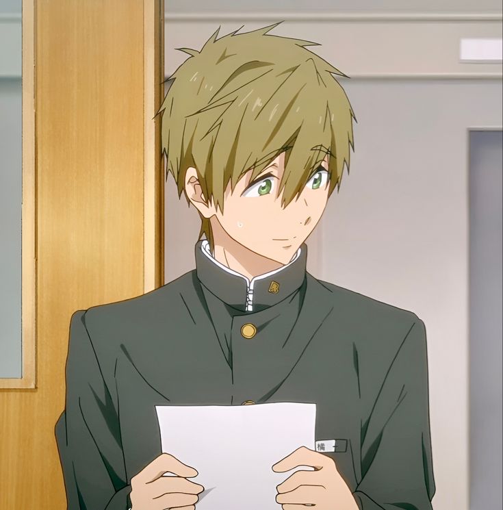 an anime boy with green hair and green eyes is standing and looking towards the right. he is wearing a school uniform. he is holding a piece of paper in his hands and smiling happily.