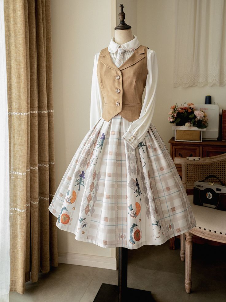 a fulllength view of a classic lolita fashion outfit. the dress features a white and brown plaid skirt with embroidered fruit motifs, paired with a matching brown vest. a simple white blouse with a peter pan collar is worn underneath. the outfit is displayed on a mannequin in a room with natural lighting.