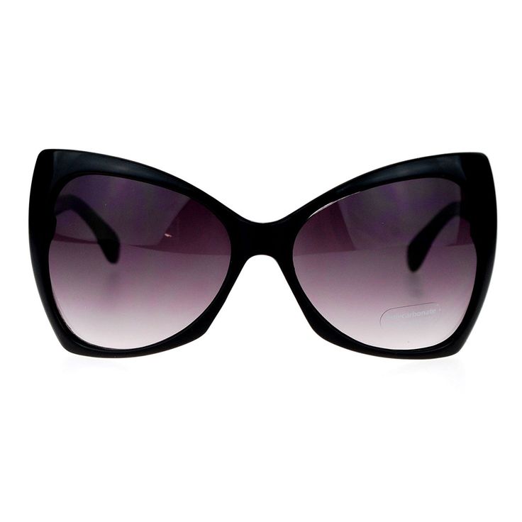 a closeup shot shows a pair of black, oversized cateye sunglasses with dark, shaded lenses against a white background.