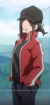 a young anime girl with short black hair wearing a black cap and a red jacket is shown standing with one hand in her pocket. the background is a blurred outdoor setting, suggesting a casual daytime scene.