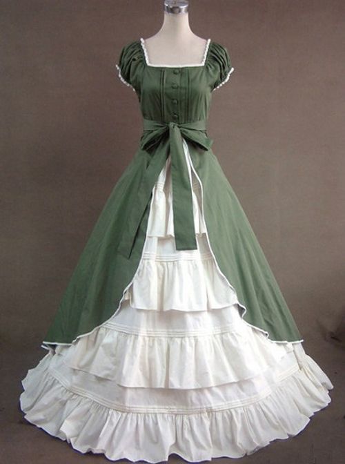 a green and white victorianstyle ball gown is displayed on a mannequin. the gown features a fitted bodice with short puffed sleeves, a square neckline, and a long flowing skirt with multiple layers of ruffles and lace. the bodice is green with white buttons and a matching green sash tied at the waist. the skirt is a combination of white and cream layers, creating a voluminous and romantic silhouette. the dress is set against a neutral background, drawing attention to the intricate details and elegant design.