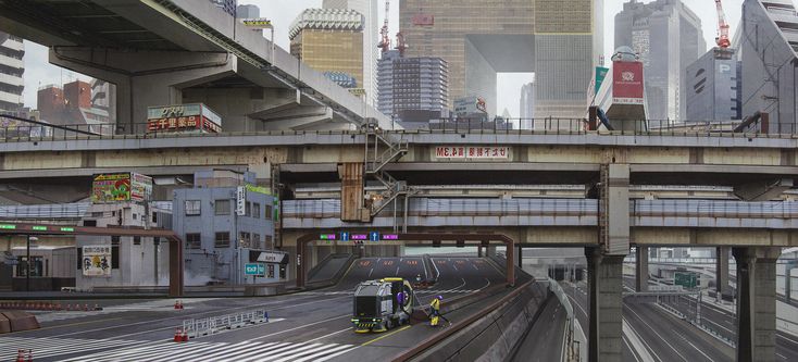 the image depicts a highly detailed and complex cityscape, possibly in japan, showing a blend of modern and older buildings interwoven with a vast network of elevated highways and overpasses.  the architecture is a mix of styles, some appearing futuristic and others more traditional. the scene is dominated by concrete and steel structures, creating a dense, almost labyrinthine urban landscape.  a cleaning truck and a worker are visible on one of the roadways, adding a sense of scale and activity to the otherwise somewhat quiet and slightly muted color palette of the scene.  numerous signs and japanese text are visible on buildings and infrastructure. the overall atmosphere is a blend of urban density and a slightly dystopian or futuristic feel.