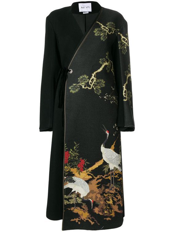 a black coat with floral and crane designs is displayed against a white background. the coat has a wrap style closure with a tie at the waist. the right side of the coat features a detailed illustration of cranes and foliage.