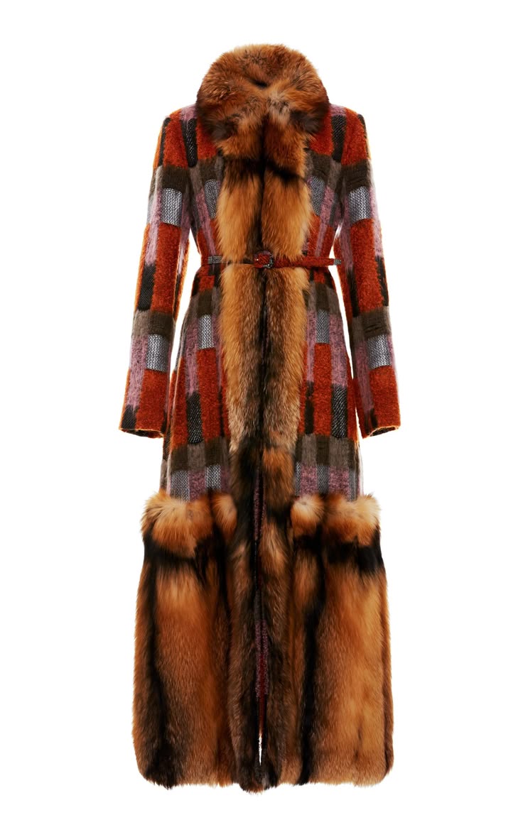 a fulllength, longsleeved coat with a patchwork design in shades of orange, brown, and gray, featuring a fur collar and fur trim at the hem, with a belt at the waist.