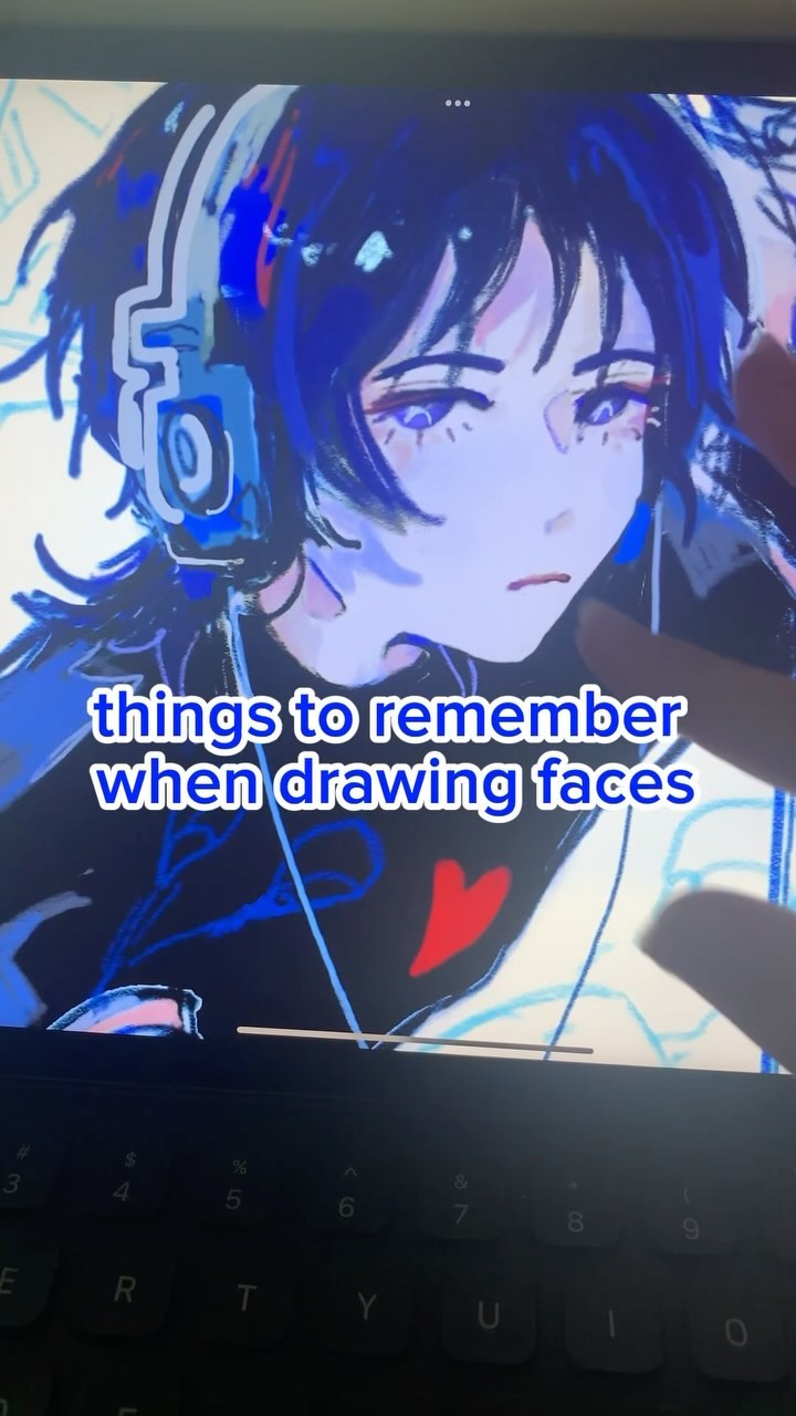 he image shows a closeup shot of a digital drawing of an animestyle female face on a tablet screen. the character has blue hair and is wearing headphones.  the text overlay on the image reads "things to remember when drawing faces," indicating that it's a tutorial or tips for drawing faces.  a portion of a keyboard is visible at the bottom of the image. the overall style is stylized and uses a vibrant color palette dominated by blues and purples.