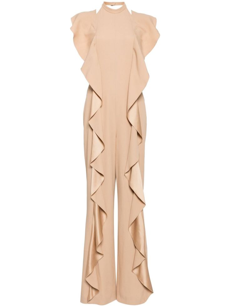 a beige sleeveless ruffle jumpsuit with a halter neckline. the jumpsuit features a fitted bodice and wide legs with ruffle detailing.  it's perfect for a formal occasion or a night out.