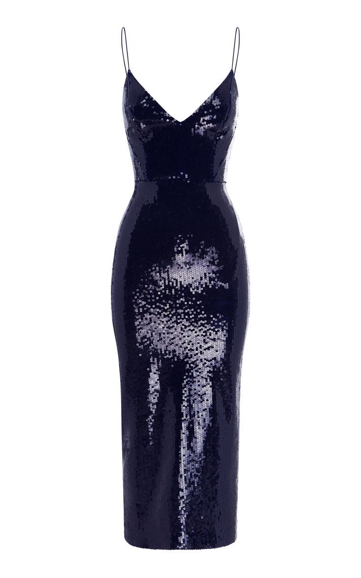 a navy blue sequined dress with spaghetti straps and a v neckline. it is slim fitting and midi length. the dress is perfect for a formal event, such as a cocktail party or evening wedding.
