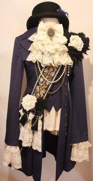 the image shows a rococo/baroqueinspired fashion ensemble, possibly a steampunk take on the historical style. a dark blue jacket with button details is prominently displayed, adorned with various embellishments such as layers of white ruffles and lace at the neck and cuffs. the neck area features a large white bow with a decorative brooch. a sash or ornate band is slung across the chest, embellished with gold and white patterns, further decorated with strands of pearls and a length of chain. additional details include a white flower with black accents attached to the shoulder and a lower decoration on the jacket featuring a white flower, a black flower, black ribbon, and more lace with pearl accents. the outfit is accessorized with a black hat, completing the ensemble's elaborate and historical look.