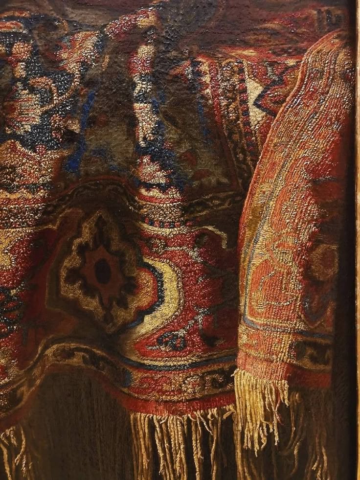a closeup painting depicts a section of an ornate oriental rug with a fringe. the rug features a complex pattern of red, blue, gold, and brown hues. it appears richly textured, with intricate details in the weave. the fringe along the bottom adds a tactile element. the composition emphasizes the rug's texture and the patterns.