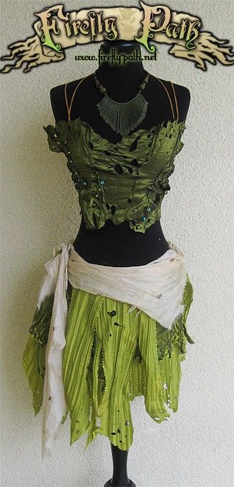 a stunning and unique dress with a green bodice and skirt, accessorized with a white fabric shawl, crafted with meticulous detail and a creative eye, capturing a whimsical and magical atmosphere, perfect for a woodland or fantasythemed event.