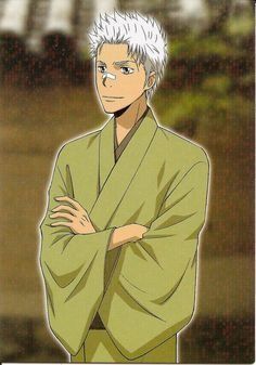 a drawing of an anime man with short white hair and a bandaid on his nose. he is wearing a pale green yukata. the background is a blurred image of a building, suggesting he is standing outside a traditional japanese house.