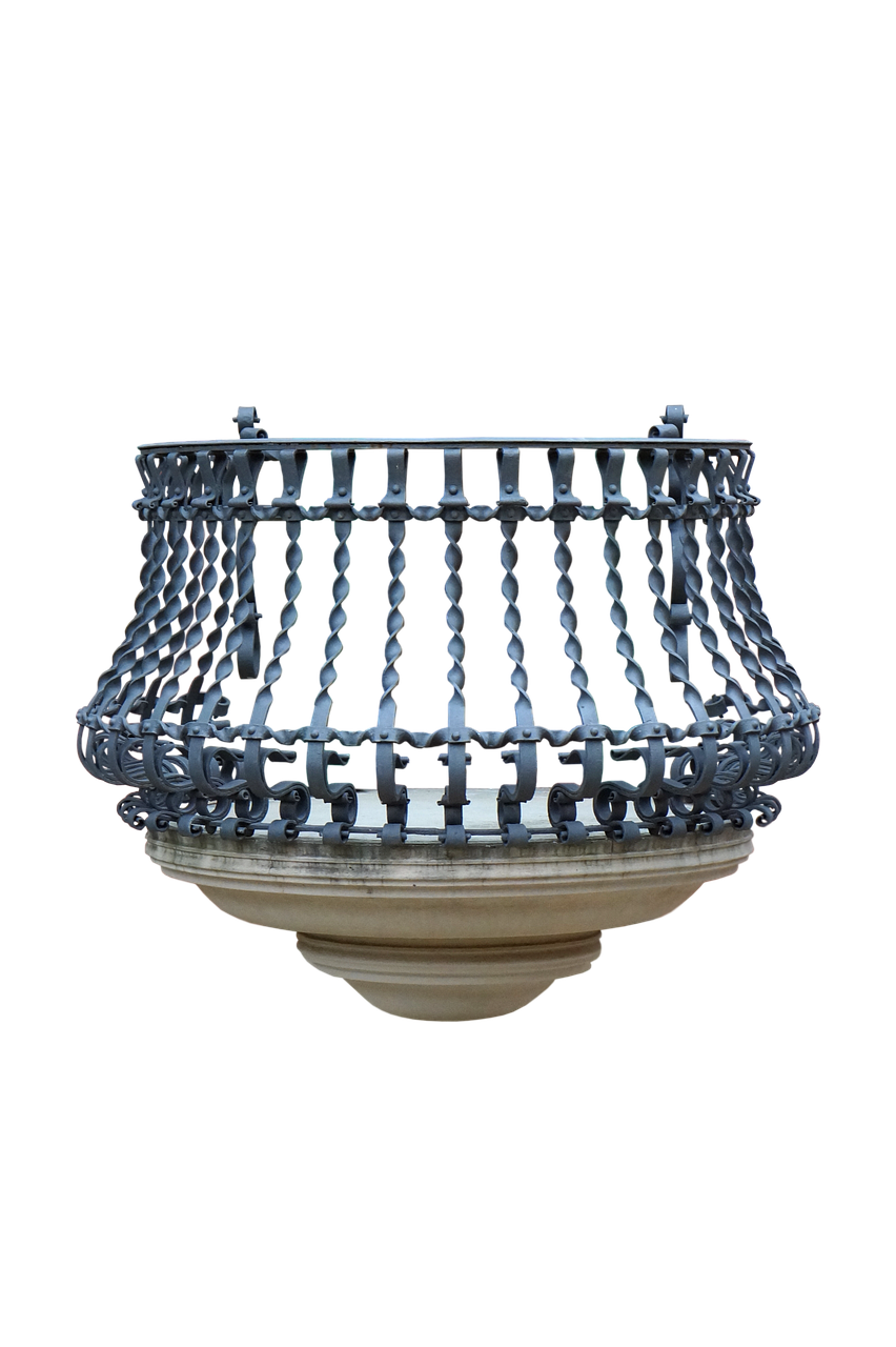 a closeup studio shot of an ornate, wrought iron balcony with a stone base against a black background. the balcony features twisted metal rods and decorative scrollwork. the stone base has a curved design.