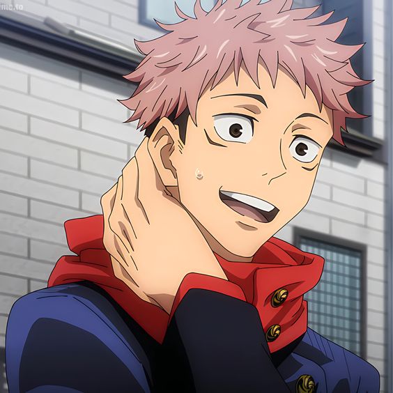 this is a closeup illustration of a young man with short, spiky pink hair and blue eyes. he's wearing a blue jacket with red accents, suggesting a school uniform. a bright red scarf peeks out from under his jacket. he has a joyful expression on his face, with a wide smile and his hand gently touching his cheek.  the background suggests an indoor setting, possibly a school hallway, illuminated by bright, natural light, creating a cheerful and inviting atmosphere.