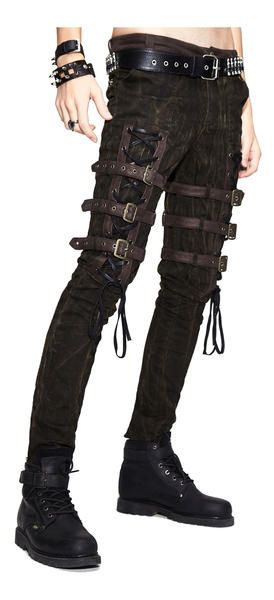 a man wearing black pants with leather straps and buckles on them. he is also wearing black boots with a belt and buckle on them. the person has many bracelets on their wrist. the background is white. the image is in fashion style.