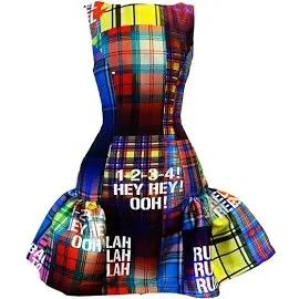 a highwaisted dress with a plaid patchwork design, featuring ruffles at the bottom and text printed on the fabric.
