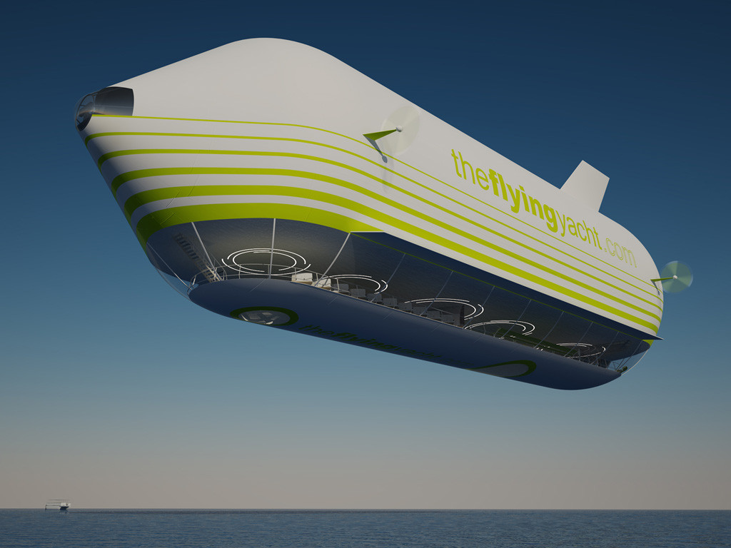 a large, white and green airship, with the words "theflyingyacht.com" printed on its side, flies over a calm blue sea. the airship has a glass bottom, which allows people to see out. the airship is very large, and it looks like it would be able to carry a lot of people.