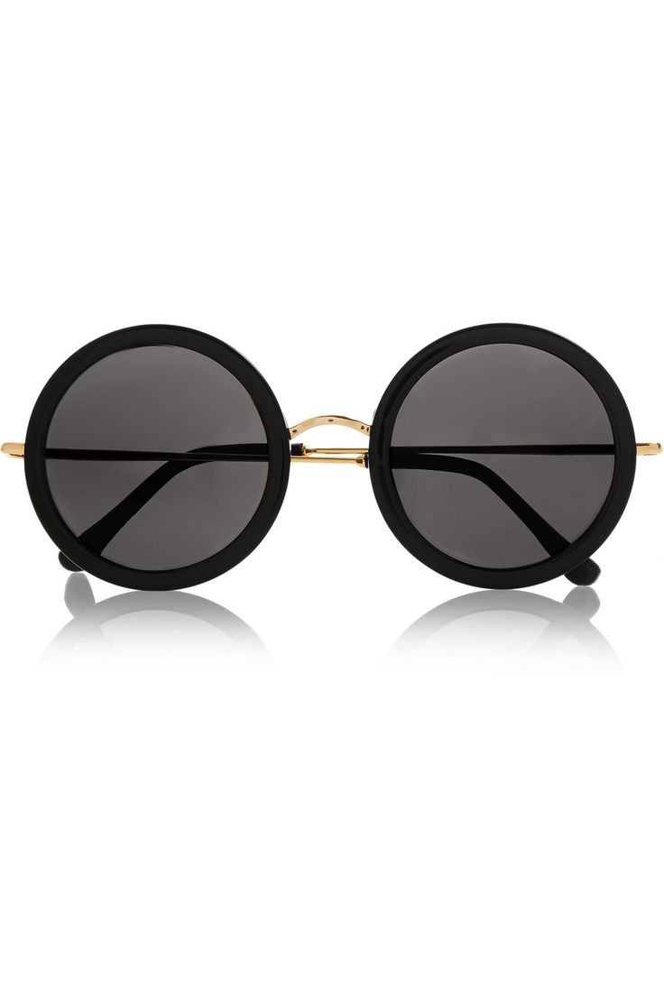 a pair of round sunglasses with black frames and a gold bridge, viewed from the front against a white background.