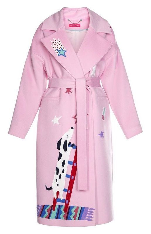 a light pink coat with a graphic of a black and white spotted dog climbing a red and blue ladder on the front. there are also stars and a shooting star on the coat. the bottom of the coat has a graphic of a colorful carpet. the coat is tied with a belt. the brand is zabella.