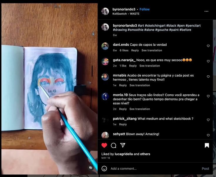 the image shows a closeup video still of an artist's hand painting a portrait of a woman in a sketchbook. the woman's face is partially visible, with distinctive bluegreen hair and colorful eyeshadow. the artist is using a tealcolored brush and appears to be working with gouache. the image also features an instagram post with the artwork, along with numerous positive comments from people in different languages praising the artist's talent and skill.  the post includes hashtags related to the artistic techniques and materials used.