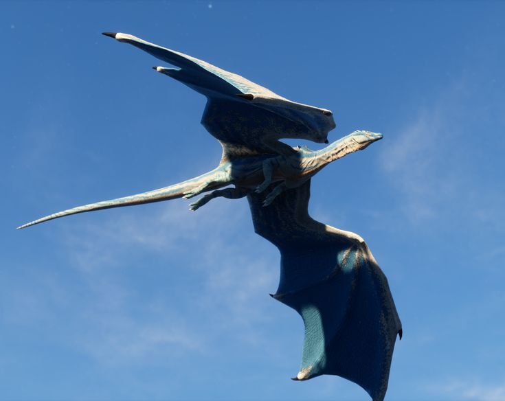 a blue dragon is flying in the sky. the dragon has large wings and a long tail. it is a mythical creature. the sky is blue with some clouds.