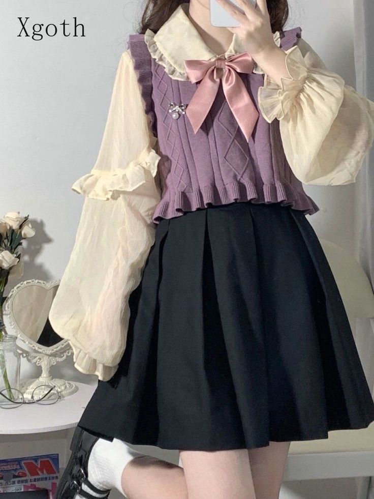 a young woman poses for a fashion shot in a cute, gothinspired outfit.  she wears a ruffled, creamcolored blouse with a purple knit vest accented with a large pink bow.  a black pleated skirt completes the look. she is posing with one hand up, taking a picture of herself in a mirror. the setting suggests a bedroom or dressing area, with flowers visible in the background and a magazine on a table.