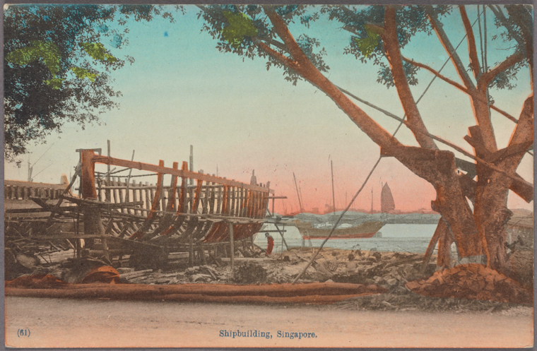 an old postcard depicts a shipbuilding scene in singapore. a wooden ship is under construction in the foreground, supported by scaffolding. in the background, a harbor is visible, with other ships and masts dotting the horizon. a large tree with thick branches stands to the right of the ship. the sky is a pale blue and pink hue, typical of vintage photographs. the bottom of the postcard has the words "shipbuilding, singapore." and the number (61) is written on the bottom left.