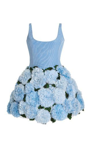 the image shows a blue mini dress. the bodice is a light blue fabric with a subtle texture. the skirt is covered in blue floral embellishments.