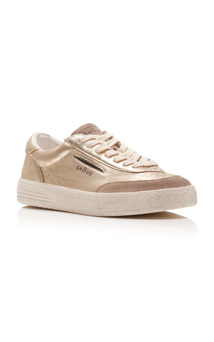 a pair of ghoud gold metallic leather and suede lowtop sneakers are displayed on a white background. the shoes are laceup and have a casual design. they are perfect for spring, summer, and autumn.