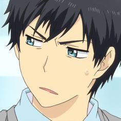 the image shows a closeup illustration of an anime boy. he has short, dark blue hair and striking blue eyes. he appears to be slightly annoyed, with his eyebrows furrowed and a sweatdrop visible on his cheek. he is wearing a white shirt with a light blue collar. the style of the illustration is typical of anime, with large eyes, exaggerated expressions, and a soft, pastel color palette. the closeup perspective draws attention to his expression, suggesting a moment of awkwardness or mild frustration.