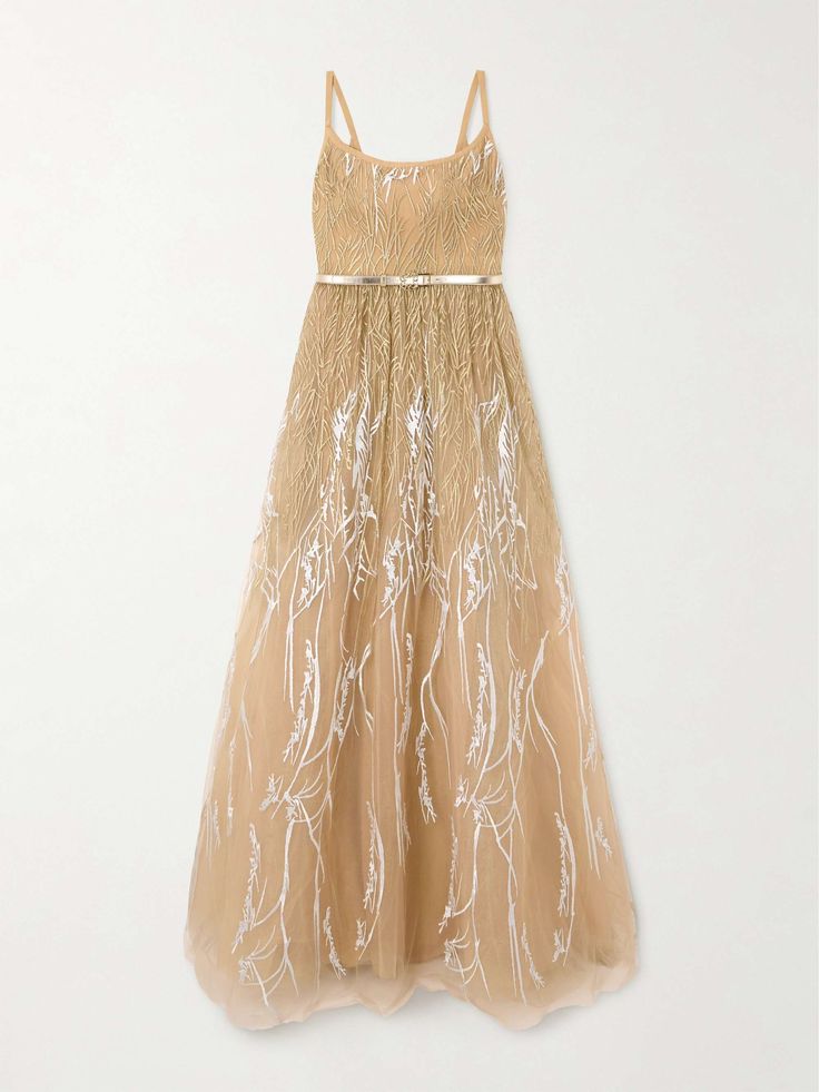 this is a beautiful long, golden gown with a delicate floral embroidery pattern. the dress is made of tulle and features a sleeveless bodice with thin straps and a fitted waist with a golden belt. the skirt flows elegantly to the floor. this is a perfect choice for a special occasion, like a wedding, prom, or formal party.