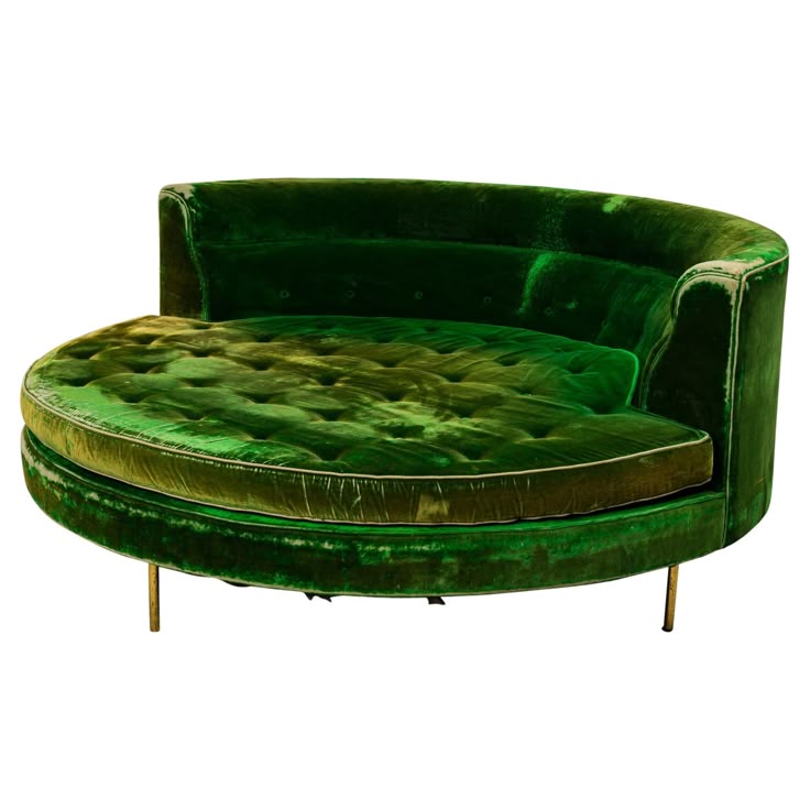 the image shows a circular, retrostyle green velvet sofa. it has a tufted cushion seat, a rounded back, and is elevated by slender brass legs. the sofa appears to be vintage or antique in design.