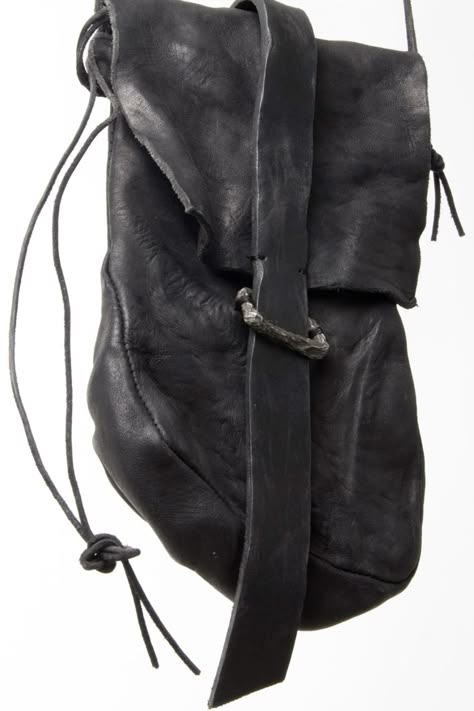 a black leather bag with a flap top and a buckle closure. it has a strap that can be worn on the shoulder or crossbody. the bag is made of highquality leather and has a vintage look. it is a timeless design and is perfect for everyday use.