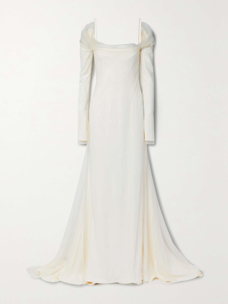 a white bridal gown with long sleeves, off the shoulder neckline, and a sweetheart neckline. the gown has a tulle overlay and is made of satin. it is a simple and classic style that is perfect for a wedding or other formal occasion. the dress is on a white background, and the model is not visible.