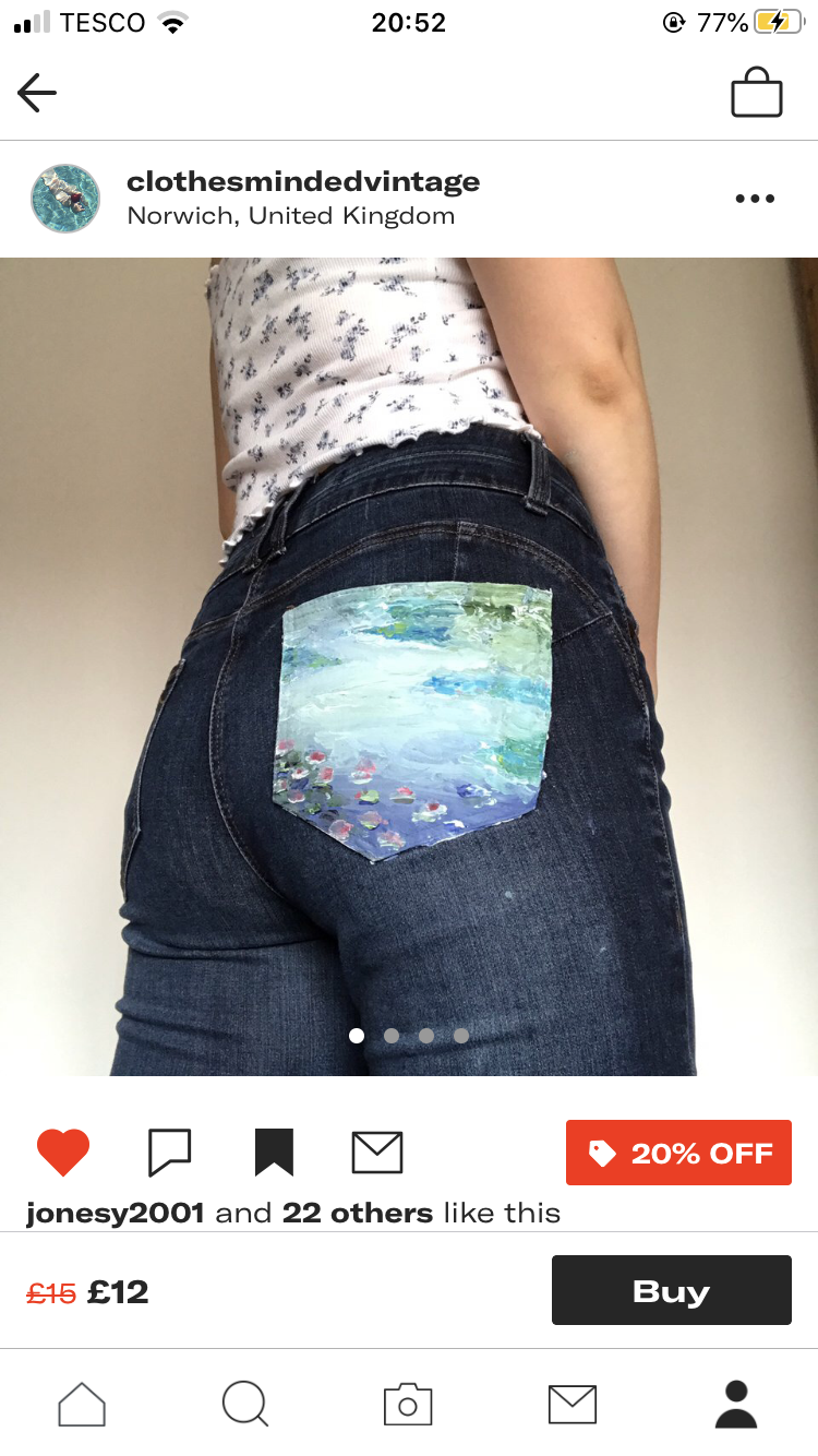 the image showcases a pair of dark wash jeans from the back. the main focus is the back right pocket, which features a unique handpainted design resembling a blue and white abstract landscape or clouds. the jeans are displayed against a plain, lightcolored background, emphasizing the artwork.  the top of the image shows the interface of an online shop, indicating these are for sale. information like the seller's username, location, original and discounted price, a "20% off" tag, and a "buy" button are visible.  the presence of "likes" suggests this is a social media marketplace or has social media integration.