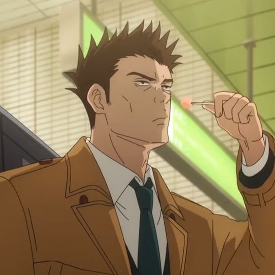 the image shows the upper body of an adult man with short brown hair and brown eyes.  he's wearing a white dress shirt, dark blue tie, and a brown trench coat.  he has a bored or tired expression on his face and is holding a lit cigarette up to his face.  the environment suggests he is in a train station.  the lighting in the image is soft. the image is a close up of the man.