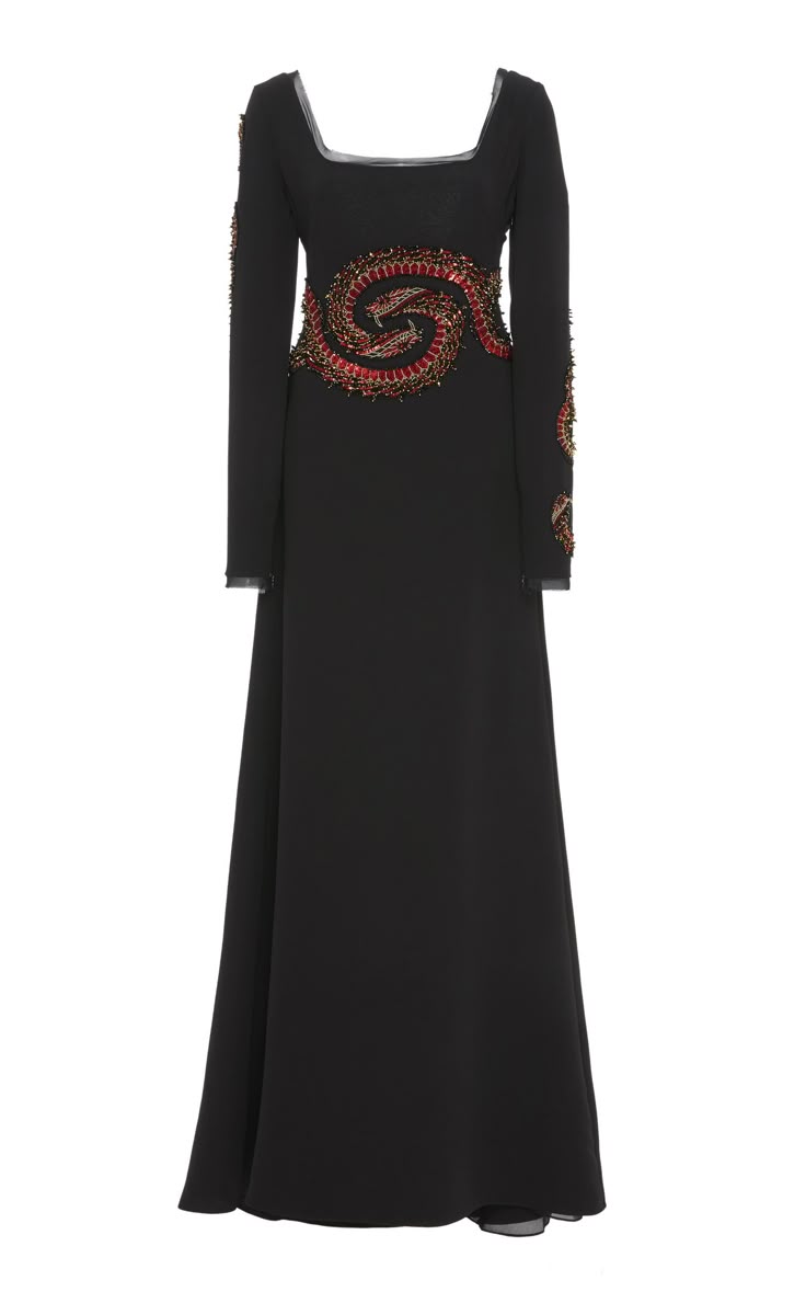 a black evening gown with long sleeves and beaded detailing around the waist and sleeves, featuring a square neckline and a floorlength design.
