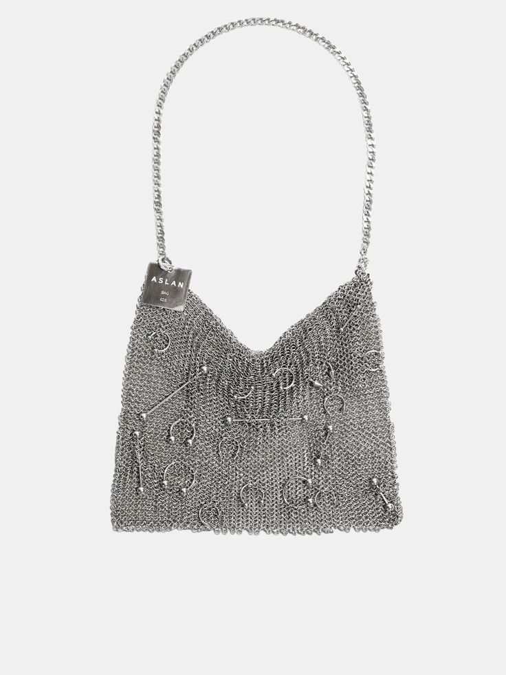 a silver metal chain purse with a silver tag that says aslan. the purse has metal rings and ball studs on it.