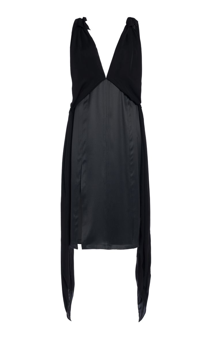 a black silk and satin dress with a vneck and sleeveless. the dress has a gathered skirt and ties at the neck. it is a formal, elegant dress that would be appropriate for an evening event.